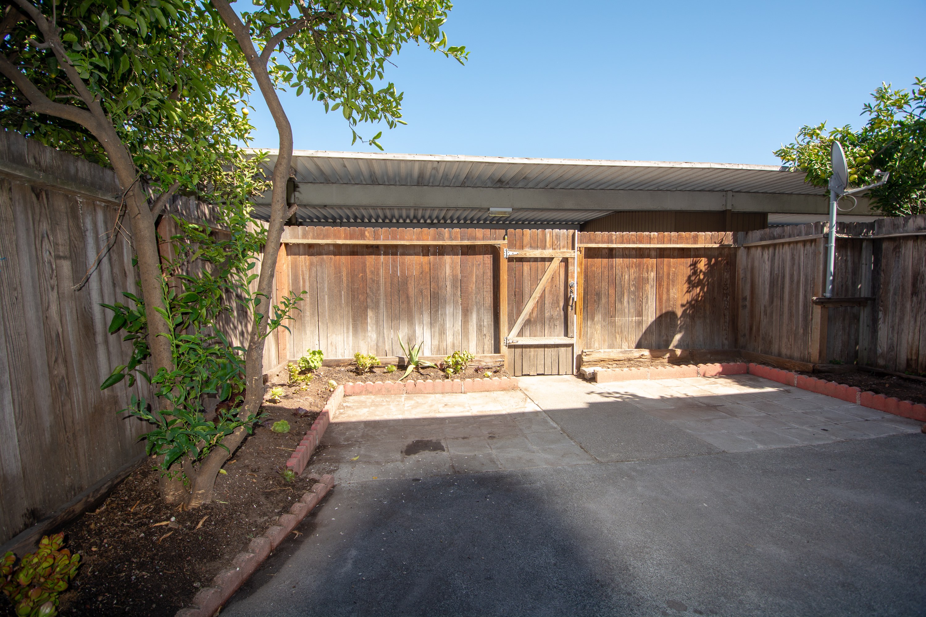 Quiet backyard with carport access